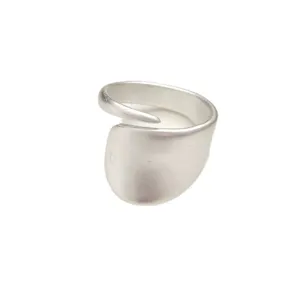 Detailed close-up view of the irregular matte silver open ring showcasing its unique design.