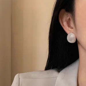 Silver spherical hollow woven stud earrings for women, minimalist chic daily jewelry.