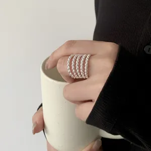 Multi-layer twisted silver ring stackable open band jewelry close-up detailed view trendy