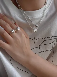Silver textured double layer necklace and ring set with cute smile face charms detail