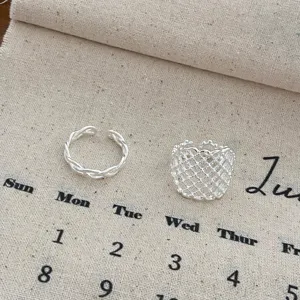 Open silver rings set featuring twisted and hollow mesh geometric designs for daily wear.