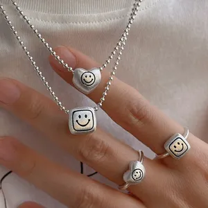 Sweet geometric heart smiley face necklace and ring set, brushed silver matte jewelry trend.