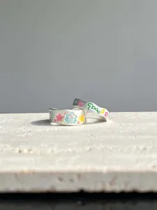 Silver open rings feature cute colorful cartoon doodles and star enamel designs for women.