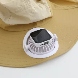 Close-up detail of a khaki sun hat with a portable solar-powered cooling fan attached.