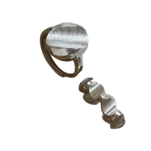 Silver irregular disc and bean stack rings minimalist indie chic fashion finger jewelry.