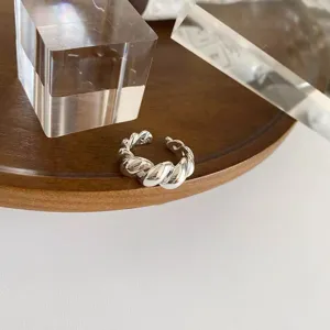 Silver twisted rope open ring for women, stylish stackable minimalist finger jewelry detail.