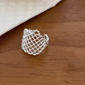 Exquisite silver mesh ring detail shot showcasing the delicate beaded edge and geometric design.