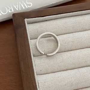 Detail shot of a minimalist silver open ring, simple geometric ring for women daily wear.