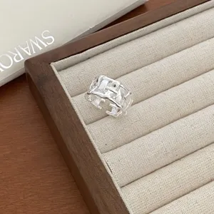 Silver woven open ring detail shot, showcasing the intricate geometric mesh texture and adjustable.
