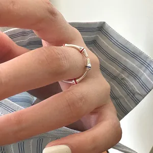 Silver bone shape open ring with colorful enamel details, trendy street style fashion jewelry for women.