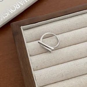 Minimalist silver open ring with modern geometric bar design for stylish daily wear.