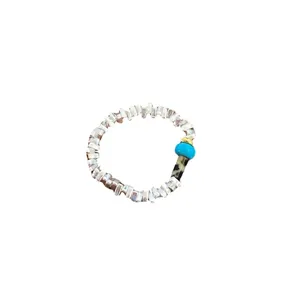Stylish beaded ring with blue and patterned accent stones for women fashion casual wear.