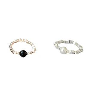 Cool style geometric textured silver rings set with black and white beads for daily wear.