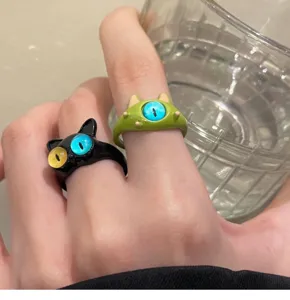 Cute cartoon cat and monster open rings featuring vibrant blue and yellow eyes for women fashion.