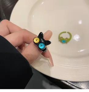 Close-up of the cute cat open ring, showing unique cartoon design and vibrant eye details.