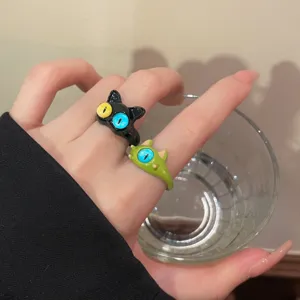 Cute cat and green monster open rings for women, quirky and trendy fashion finger jewelry.