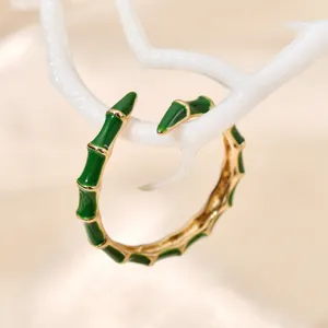 Elegant green enamel bamboo open ring with gold edges, minimalist fashion jewelry for daily wear.
