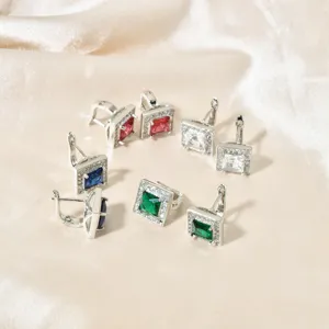 Detailed view of fashionable square cubic zirconia hoop earrings in multiple sparkling colors.
