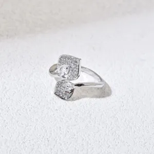 Close-up of a silver-plated leaf shaped women ring with sparkling cubic zirconia stones.
