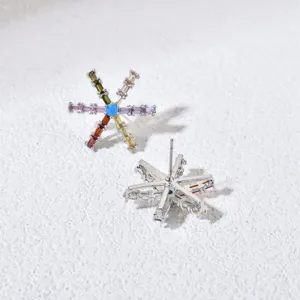 Detailed shot of colorful baguette cubic zirconia snowflake stud earrings with vibrant multi-color stones.