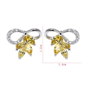 Elegante gelbe und weiße Zirkonia Schleifen Ohrstecker für Damen zur Hochzeit Party.