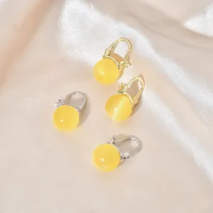 Katzenauge Ohrringe Detailansicht, elegante Gold Silber Ohrhänger für tägliches Tragen.