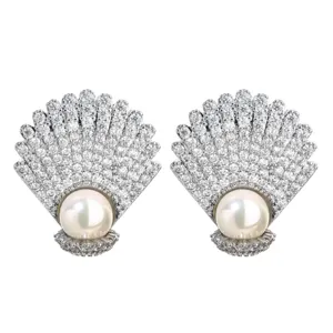 Exquisite shell pearl zirconia stud earrings, elegant ocean style detail jewelry piece.