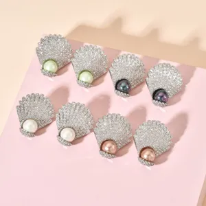 Detail view of elegant shell pearl zircon earrings, showing exquisite craftsmanship.