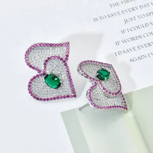 Exquisite double heart stud earrings featuring white and pink CZ with a green center stone detail.