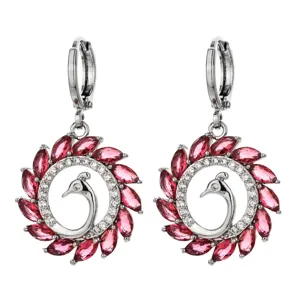 Detail shot of elegant red marquise zircon peacock hoop earrings, fine silver tone jewelry.
