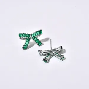 Close-up view of the exquisite green baguette zircon bow earrings showing front and post details.