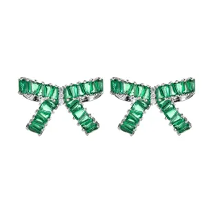 Green zircon bow stud earrings in silver tone, elegant and romantic design for women party.