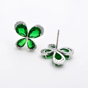Green zirconia four-leaf clover stud earrings with sparkling pave stones, elegant silver tone.