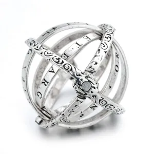 Exquisite astronomical sphere ring detail showcasing intricate engraved letters and unique foldable design.