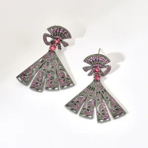 Detailed view of gunblack plated fan shaped dangle earrings sparkling with pink cubic zirconia.