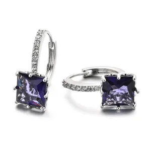 Close-up view of square purple zircon hoop earrings with delicate pave stones and silver.
