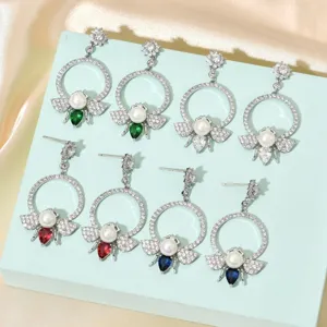 Close-up detail of exquisite bee pearl zircon earrings showcasing multi-color gemstone body options.