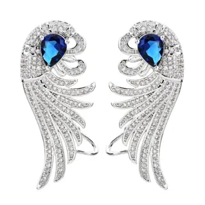 Eleganti orecchini a forma di ala con zirconi brillanti e pietra blu per le donne.