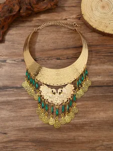 Vintage ethnic gold statement necklace with green beads and coin tassels for women.