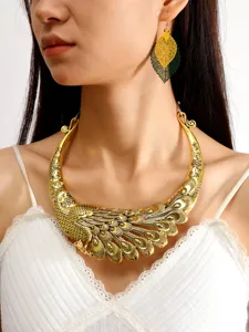 Close-up detail of the exaggerated vintage ethnic peacock statement necklace and leaf earrings.