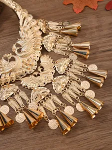 Exquisite golden Miao ethnic peacock collar necklace detail showcasing ornate bells and coin charms.
