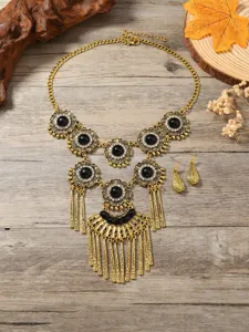 Bohemian vintage gold tone necklace and earrings set with black stone and rhinestones.