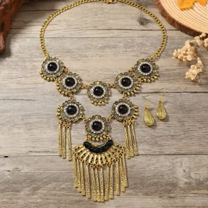 Vintage bohemian gold-tone statement necklace and elegant teardrop earrings jewelry set.