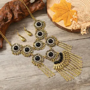 Bohemian vintage style necklace and earrings set with black stones and tassels for women.