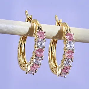 Elegant U-shaped hoop earrings featuring sparkling pink and white cubic zirconia stones.