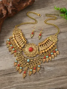 Boho ethnic style vintage alloy statement necklace and earrings set with red and blue stones.