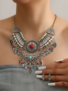 Boho vintage ethnic statement necklace and earrings set with red and turquoise stones.