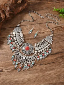 Bohemian retro silver-toned statement necklace and earrings set with vibrant turquoise and red stones.