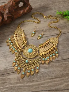 Bohemian vintage gold tone statement necklace and earrings set with turquoise beads.