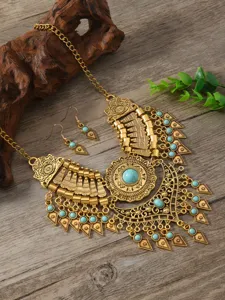 Vintage ethnic style gold statement necklace and earrings set with stunning turquoise stones.